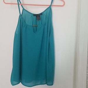 Turquoise flowy top.